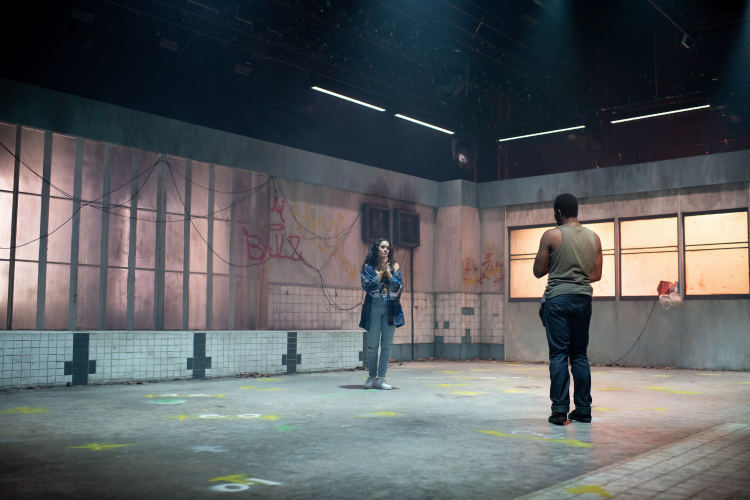 Two actors on a nearly empty set of Pod